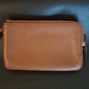 Coach wristlet skin tone/lite peach color